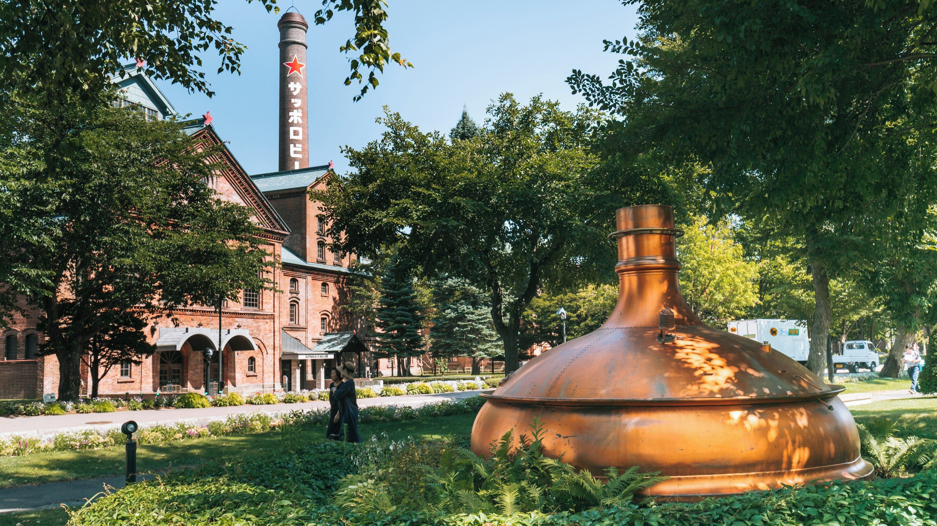 Exploring the Sapporo Beer Museum in Higashi, Sapporo, Hokkaido Prefecture, Japan, surrounded by greenery and historical architecture