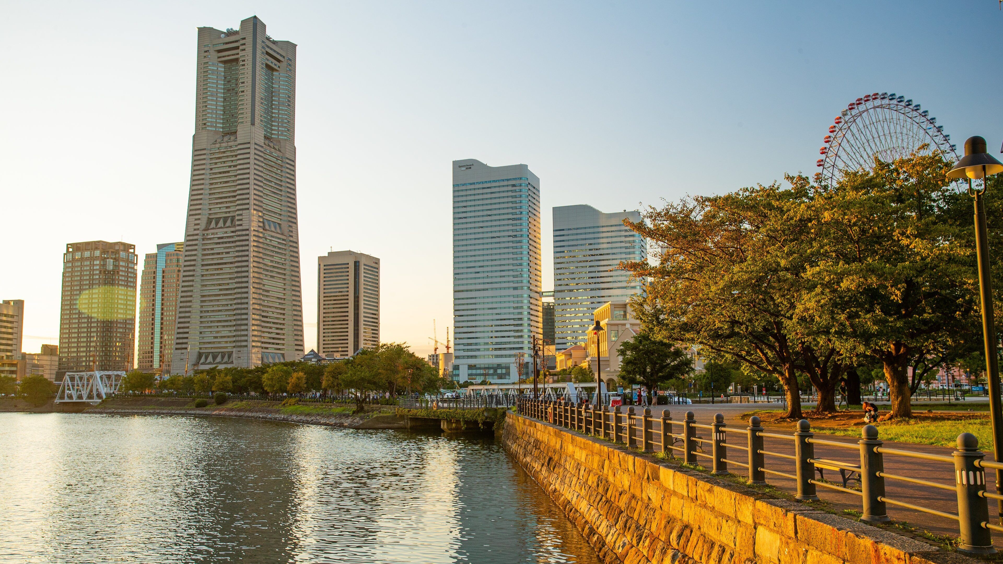 Landmark Tower which includes a city, a river or creek and a sunset