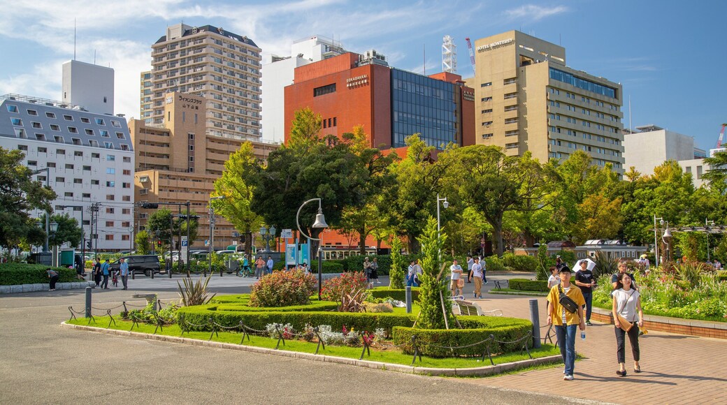 Yamashita Park which includes street scenes and a garden as well as a couple