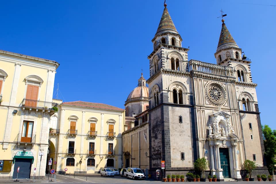 A historic church with two towers and a dome, surrounded by classic European architecture.