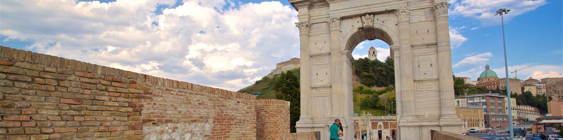 Arco di Traiano featuring heritage elements as well as a couple