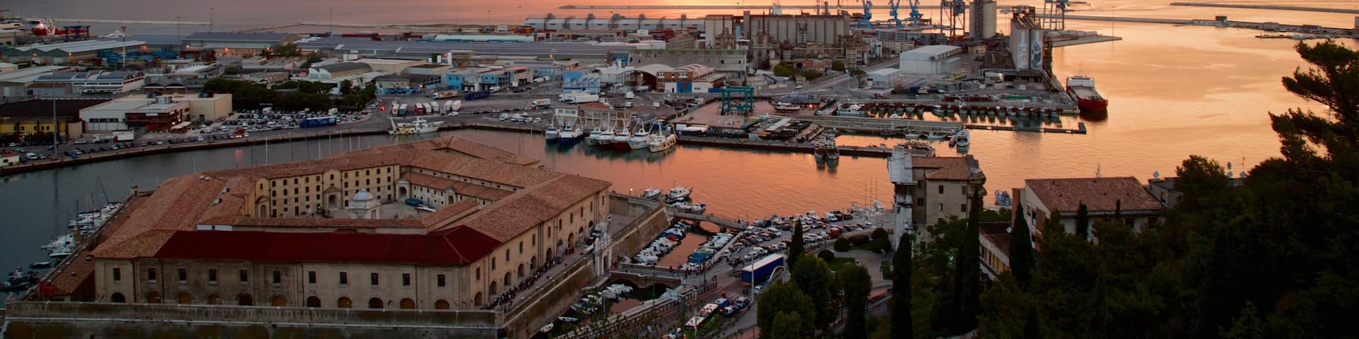 Mole Vanvitelliana which includes a sunset, landscape views and a marina