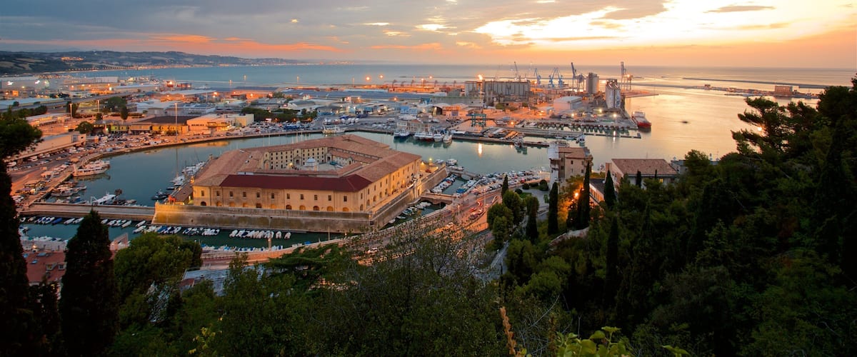 Mole Vanvitelliana featuring a sunset, a marina and general coastal views