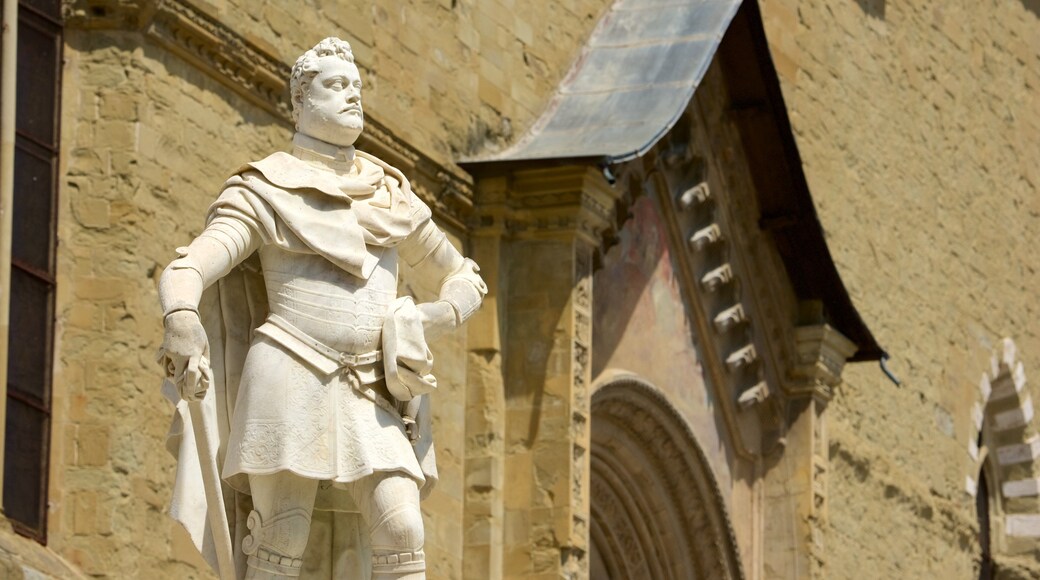Cathedral of Arezzo featuring a statue or sculpture and heritage architecture