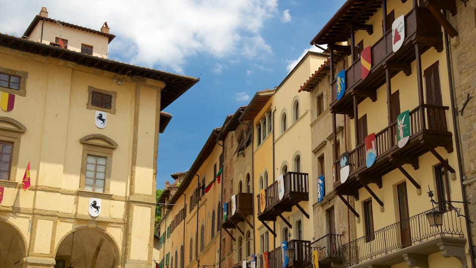 Piazza Grande which includes a small town or village