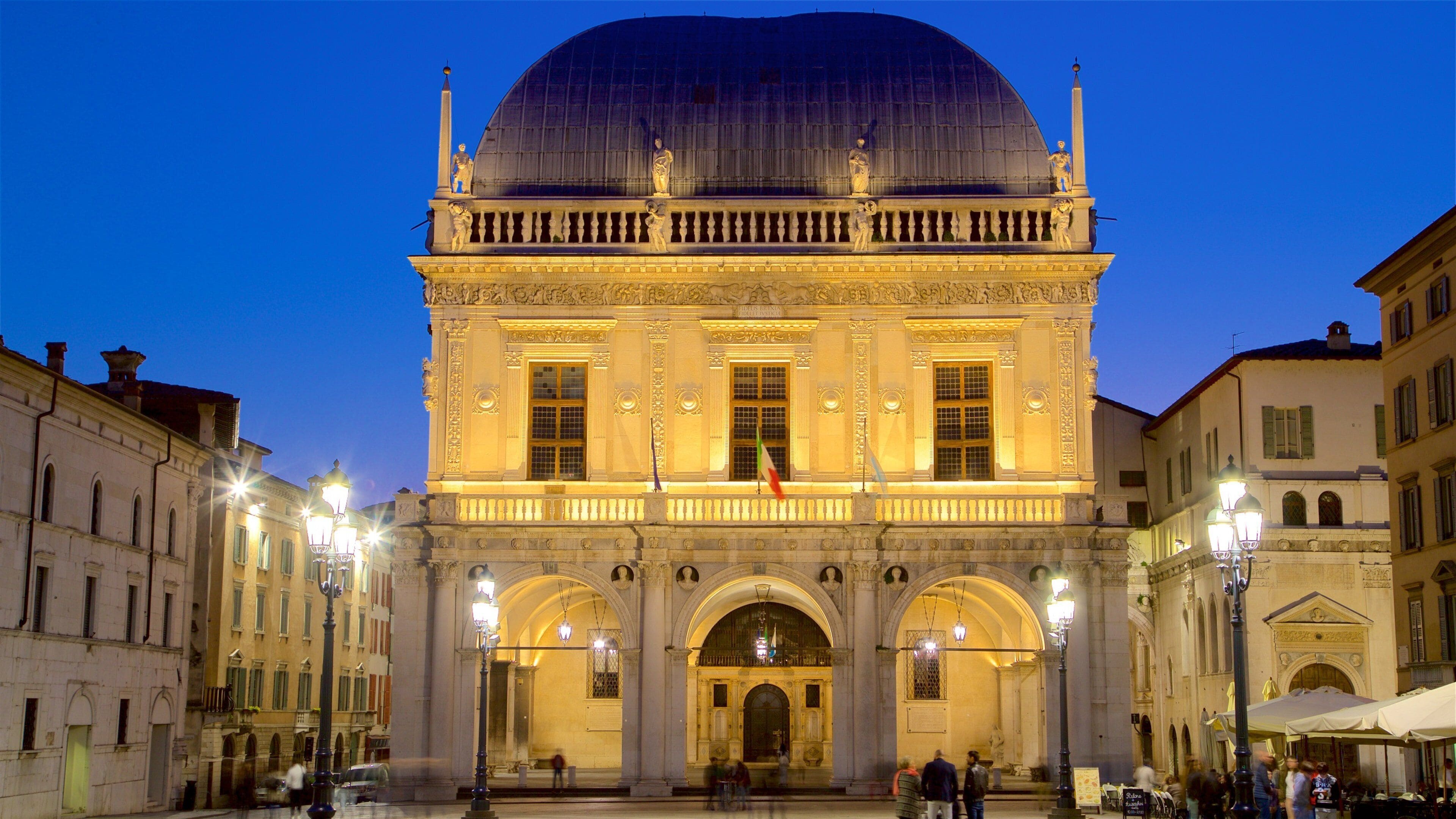 A grand neoclassical building with a large dome, ornate columns, and statues.