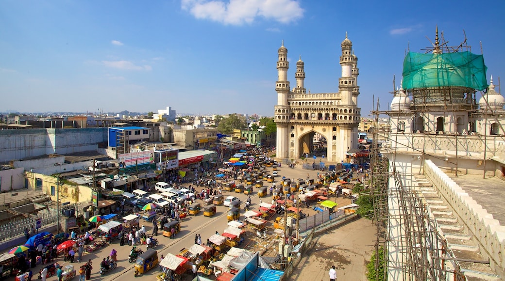 Charminar which includes a square or plaza, a mosque and street scenes