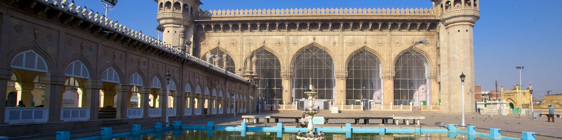Mecca Masjid which includes a pond and a mosque