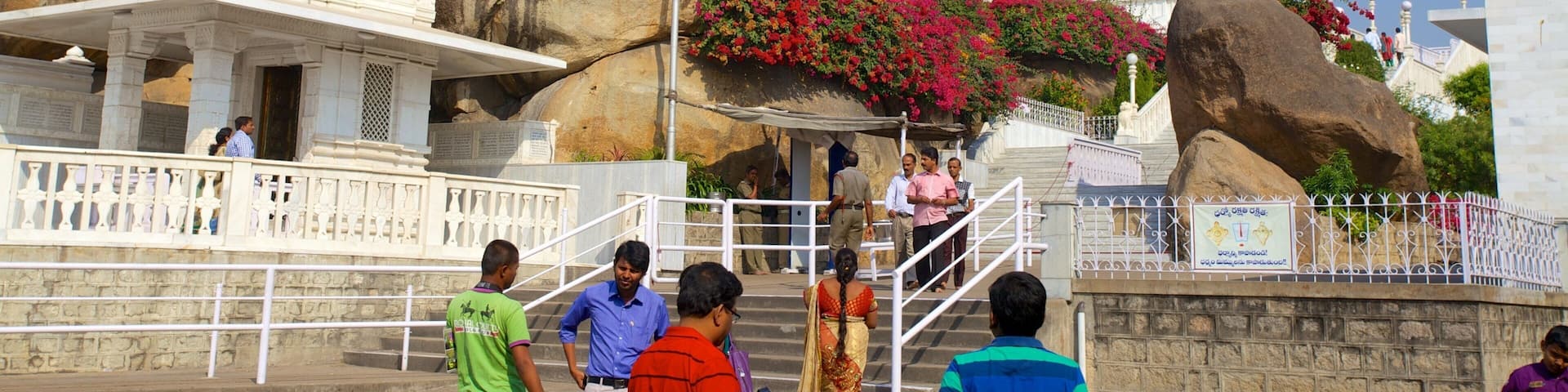 Birla Mandir Temple featuring a temple or place of worship as well as a large group of people