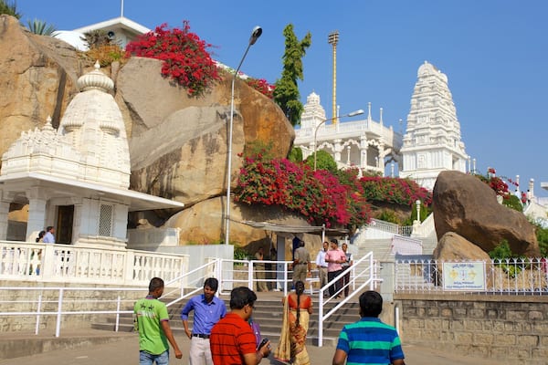 Birla Mandir Temple featuring a temple or place of worship as well as a large group of people