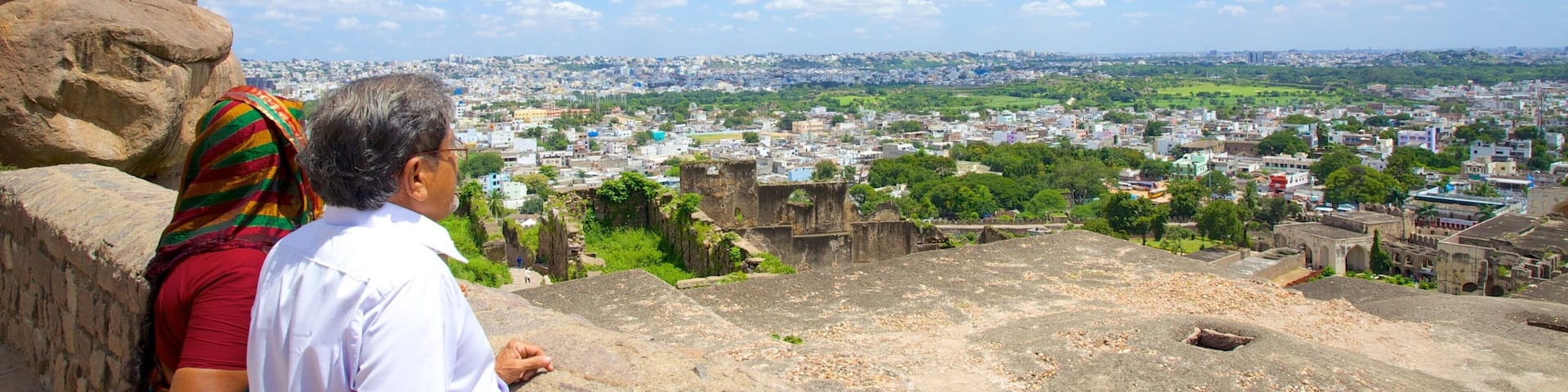 Golconda Fort showing views and a city as well as a couple