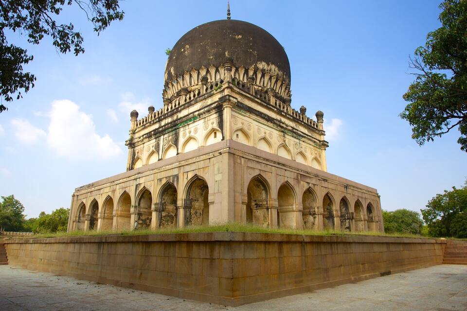 A large, historic building with a dome and arched windows.