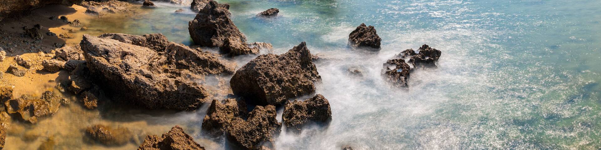 Long exposure during high tide on Lakshmanpur beach no 2 with the natural coral bridge on Neil Island in Andaman and Nicobar Islands, India.
