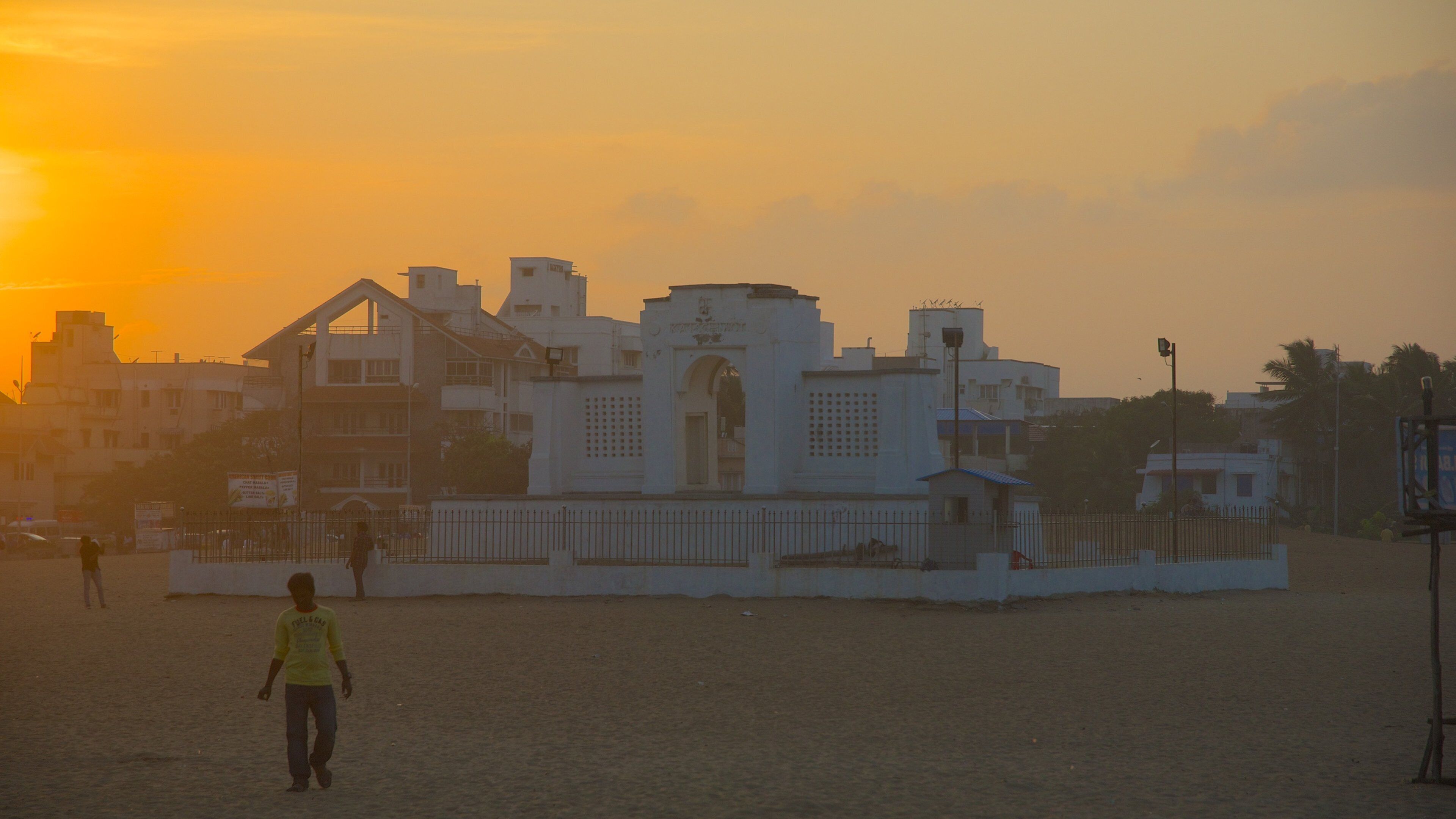 Edward Elliot\'s Beach featuring a city and a sunset