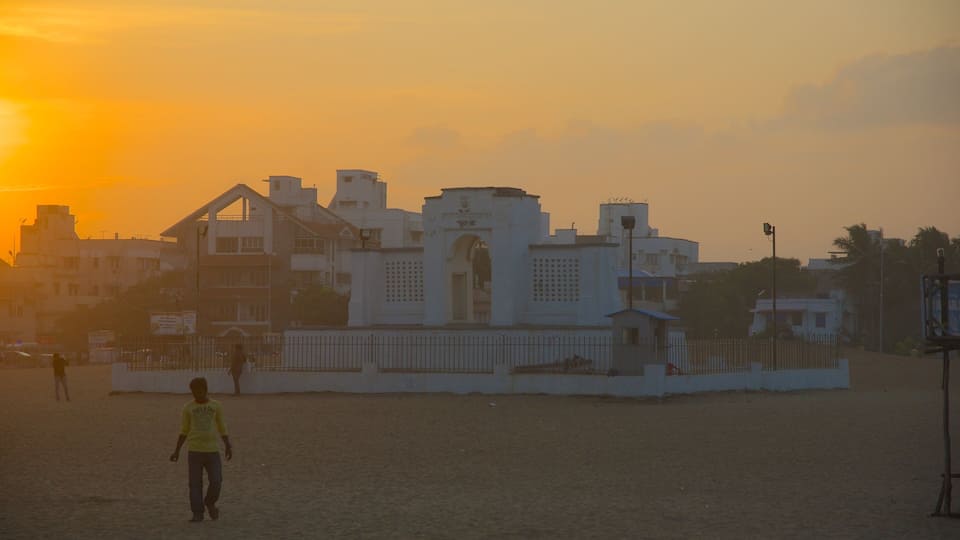 Edward Elliot\'s Beach featuring a city and a sunset