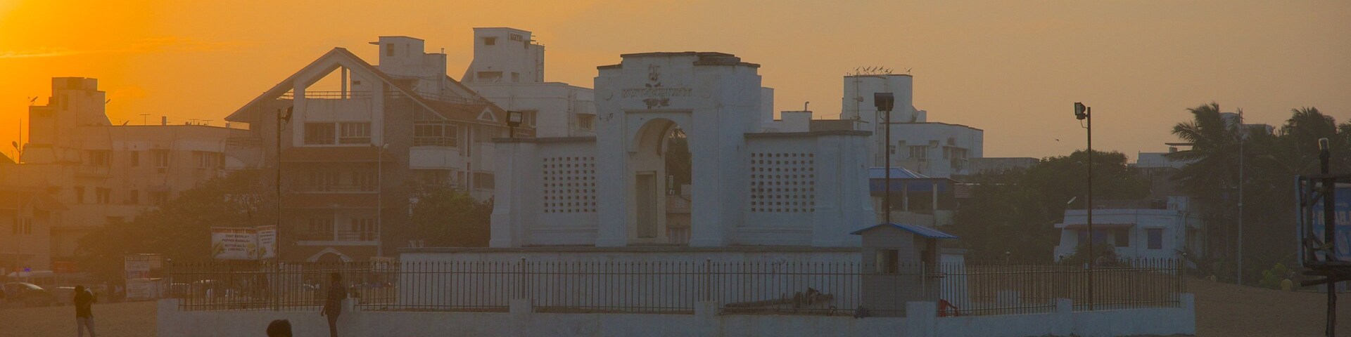 Edward Elliot\'s Beach featuring a city and a sunset