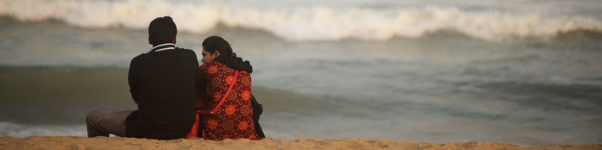 Elliot\'s Beach featuring a sandy beach as well as a couple