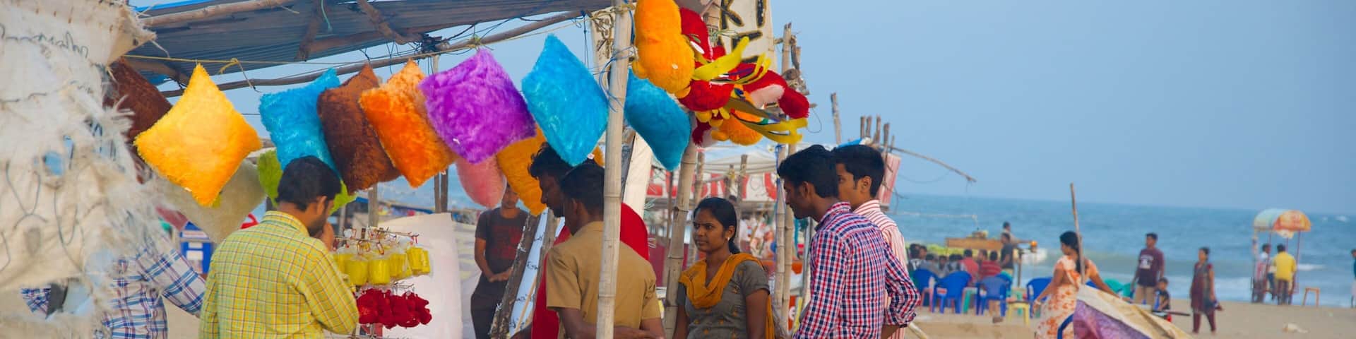 Elliot\'s Beach featuring a sandy beach as well as a small group of people
