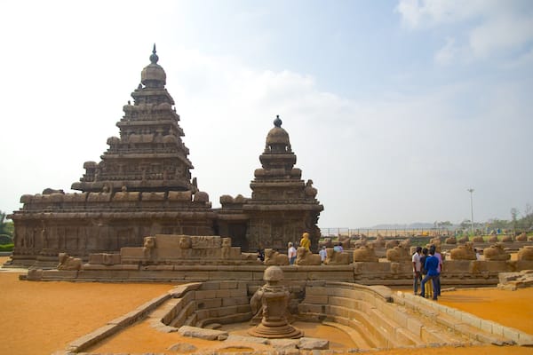 A large stone temple with multiple tiers and a central spire.