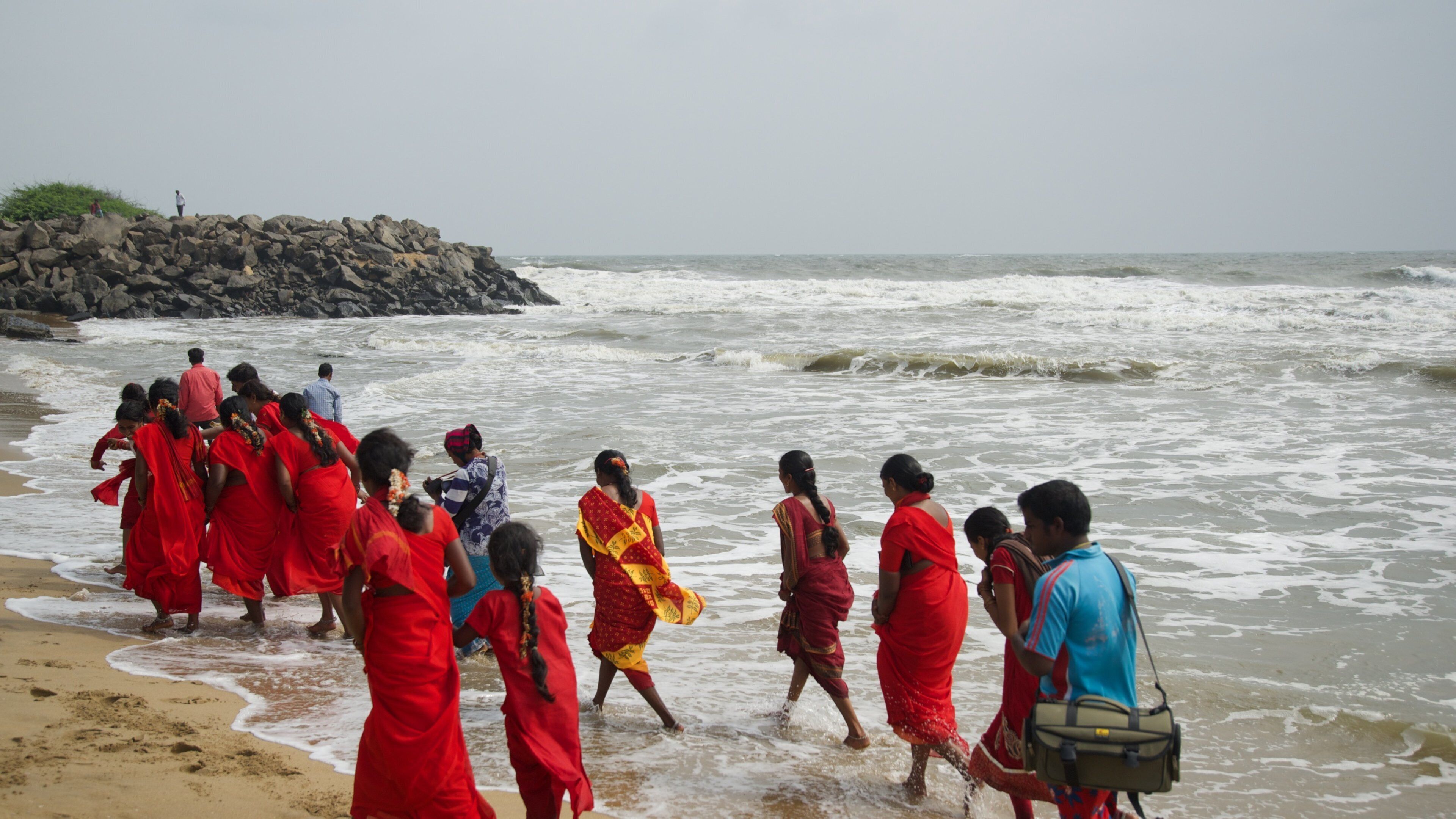 Mamallapuram Beach featuring a sandy beach as well as a small group of people