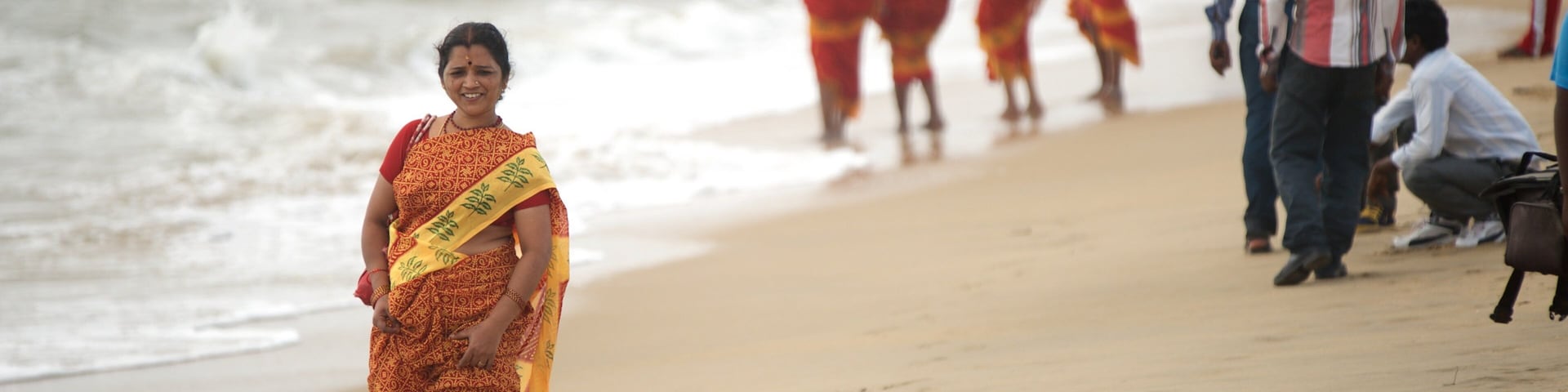Mamallapuram Beach featuring a sandy beach as well as an individual femail