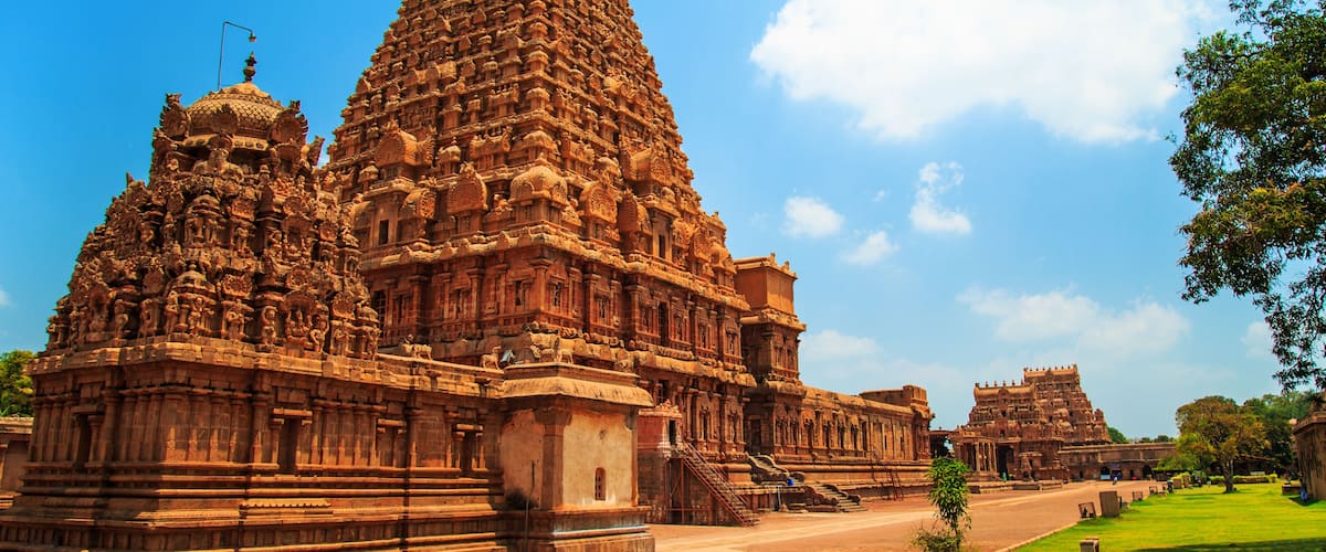 A large temple with intricate carvings and a tall spire.