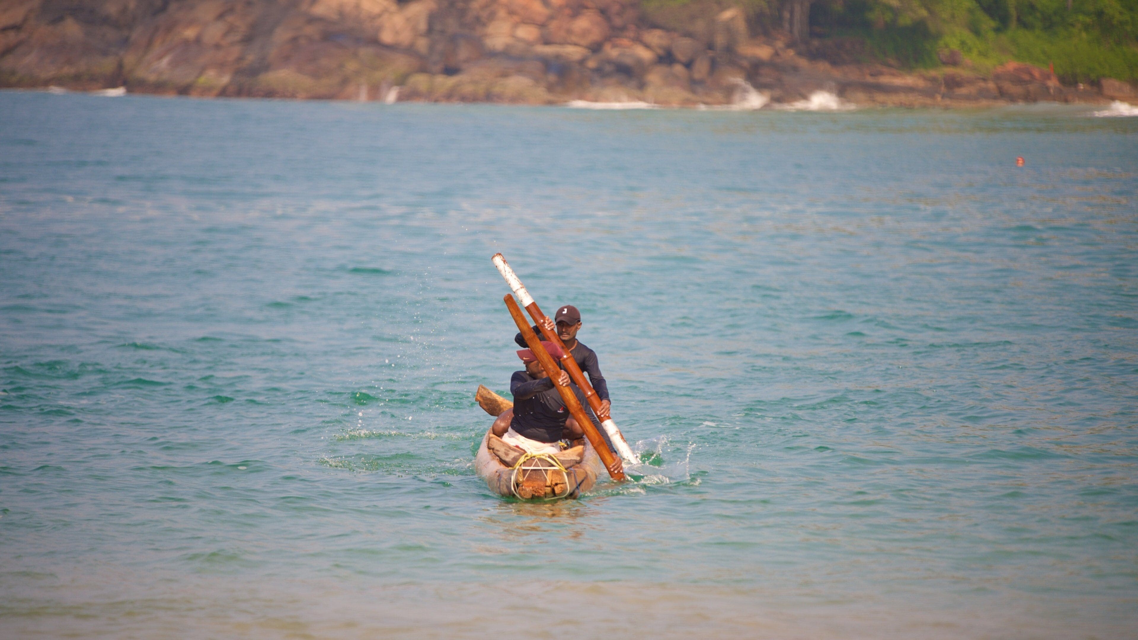 Lighthouse Beach featuring kayaking or canoeing as well as a small group of people