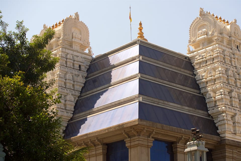 A temple with intricate carvings and a golden spire.