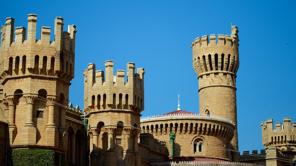 A historic castle with two prominent towers and a central dome.