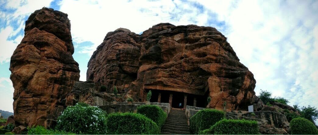 6th century cave temples in the capital of the Chalukyas. Complex of four Hindu, Jain and Buddhist cave temples.