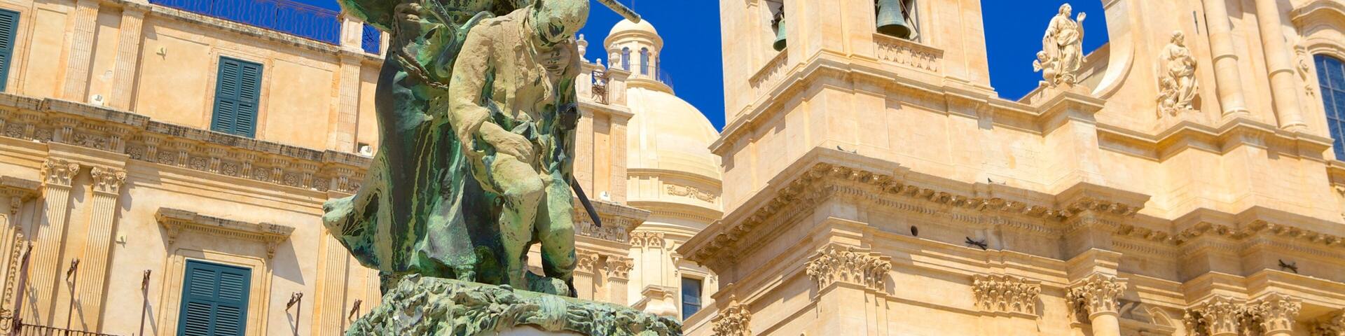 Cathedral of Noto featuring a church or cathedral, religious aspects and a statue or sculpture