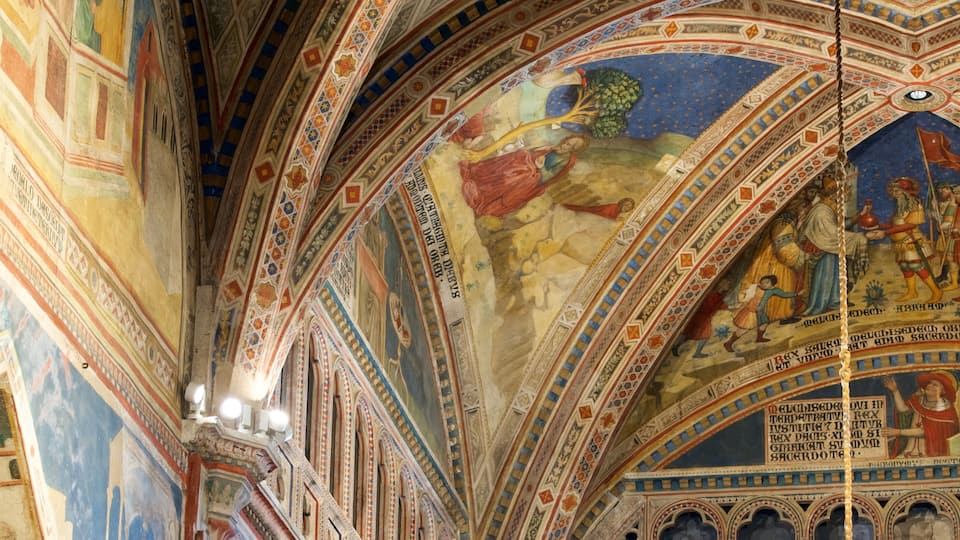 A detailed ceiling fresco with geometric patterns and figures.