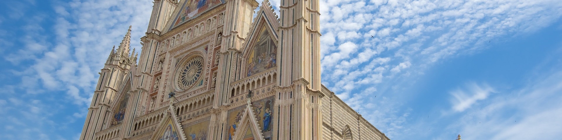 Catedral de Orvieto mostrando uma igreja ou catedral, elementos religiosos e arquitetura de patrimônio