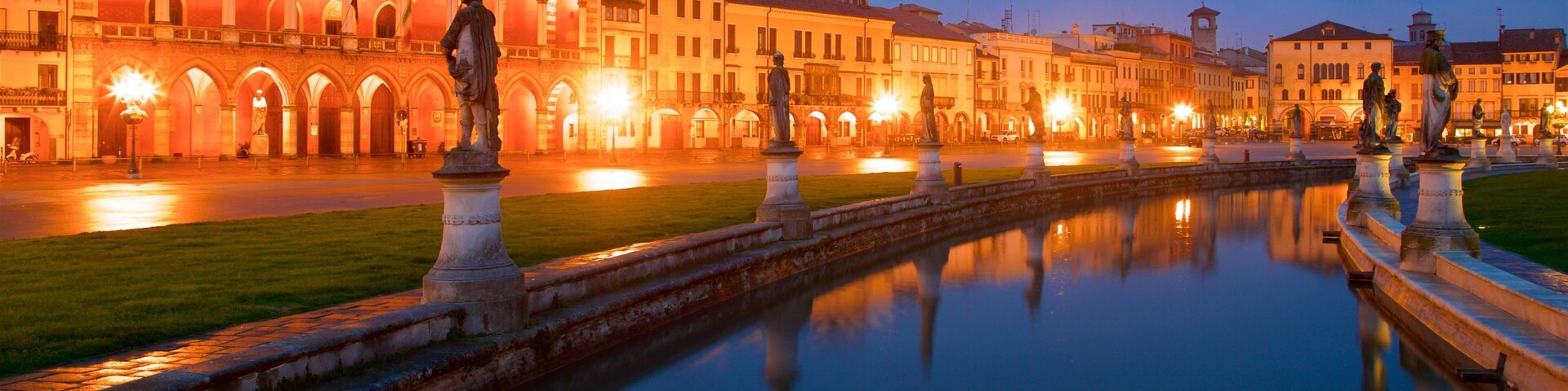 Prato della Valle featuring a statue or sculpture, a park and night scenes