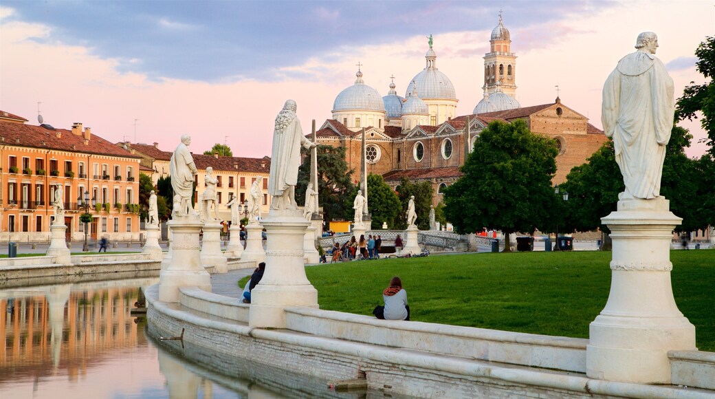 Prato della Valle which includes a park, a sunset and a river or creek