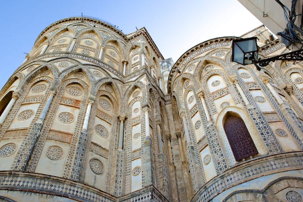 A historic building with intricate tile work and arched windows.