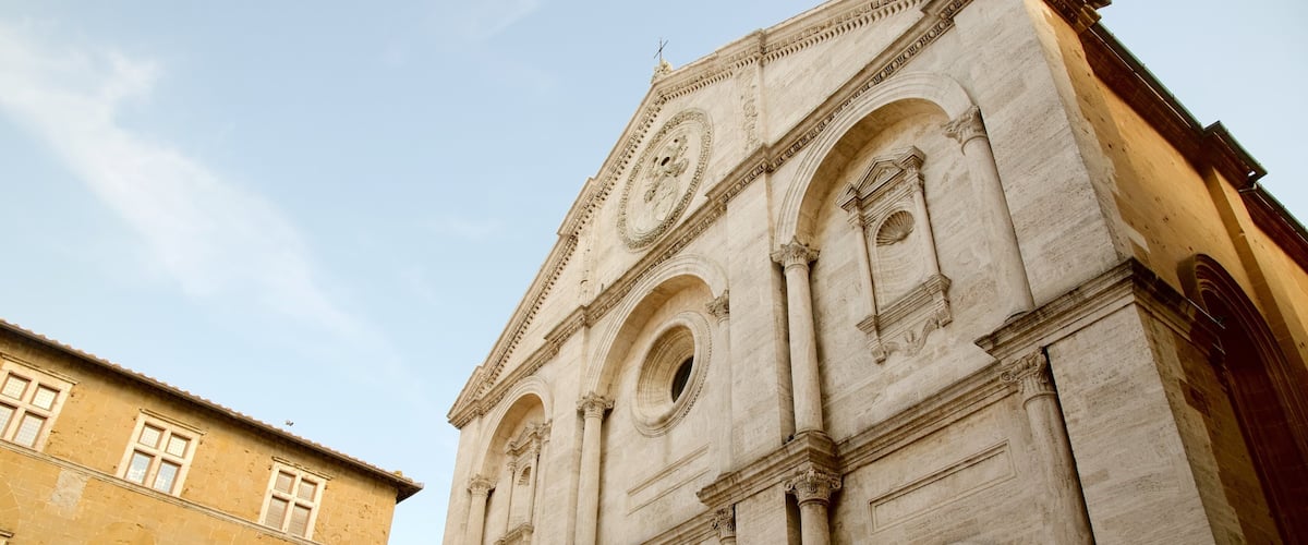 A historic building with arched windows and intricate carvings.
