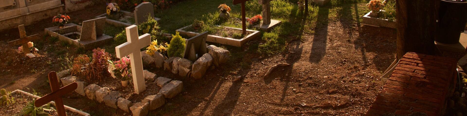 Doria Castle which includes a sunset and a cemetery