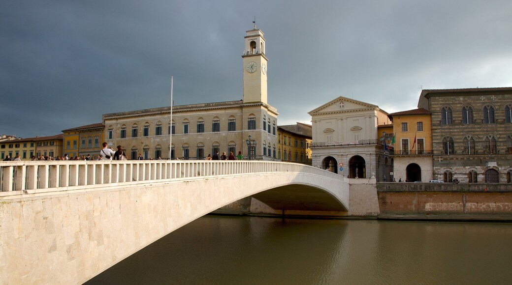 Palazzo Pretorio showing a river or creek, a city and a bridge