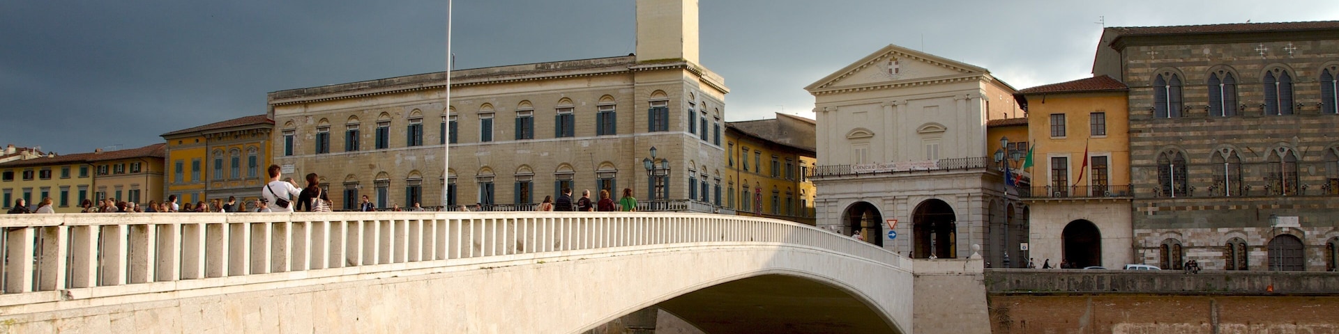 Palazzo Pretorio showing a river or creek, a city and a bridge