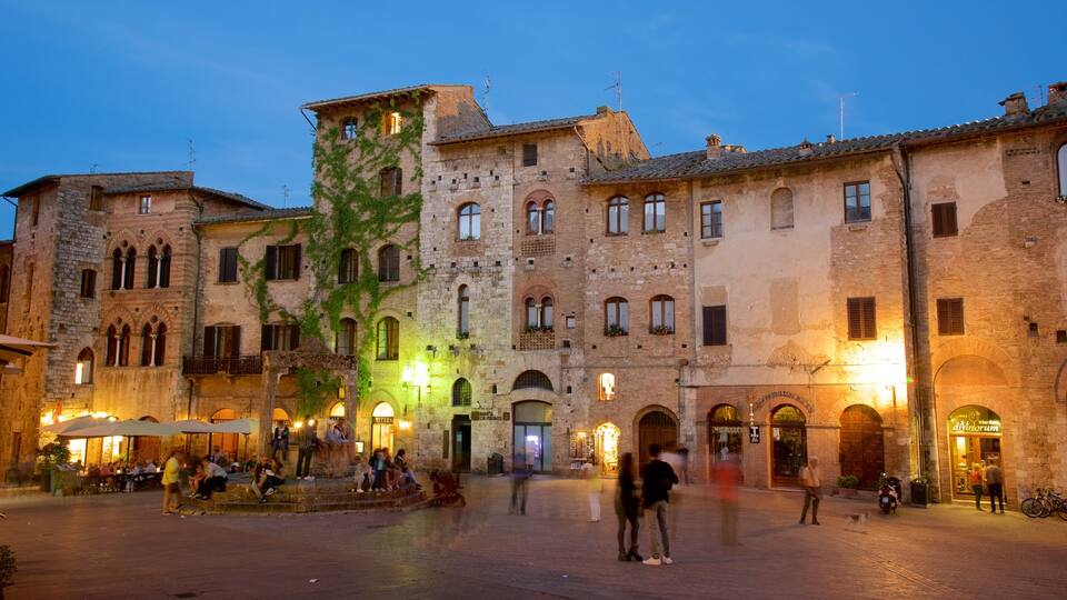 Piazza della Cisterna showing heritage architecture, a square or plaza and night scenes