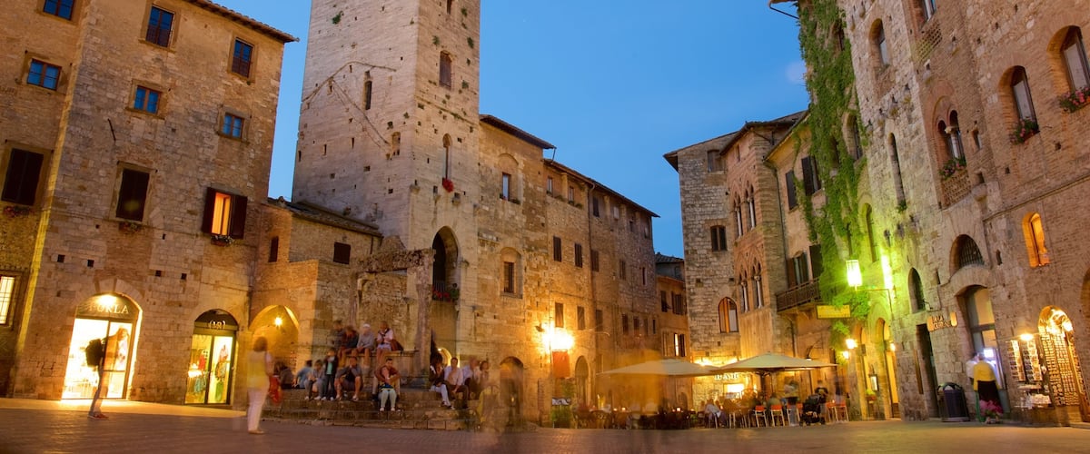 Piazza della Cisterna featuring dining out, night scenes and café scenes