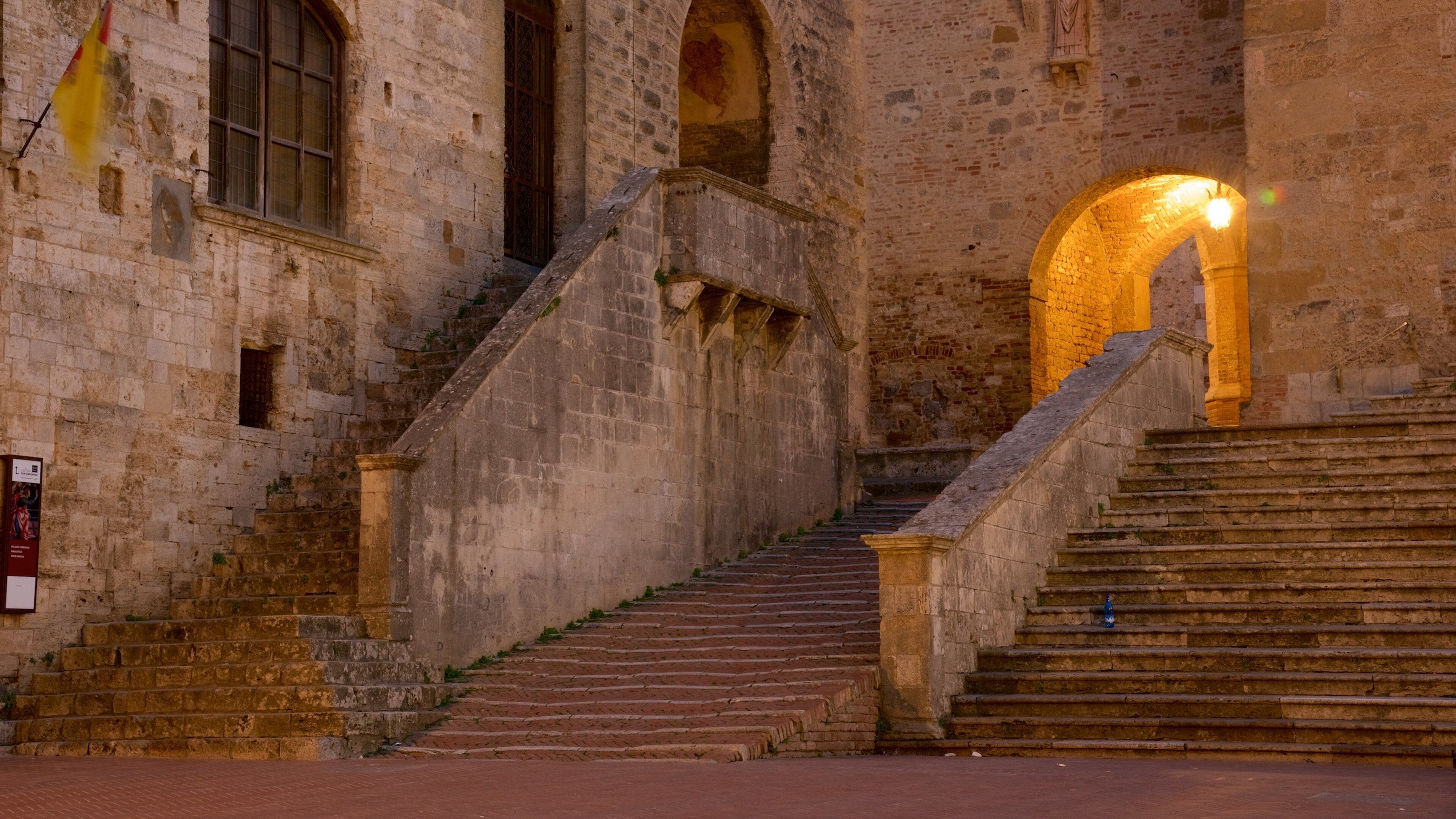 Piazza Duomo featuring a sunset and heritage architecture