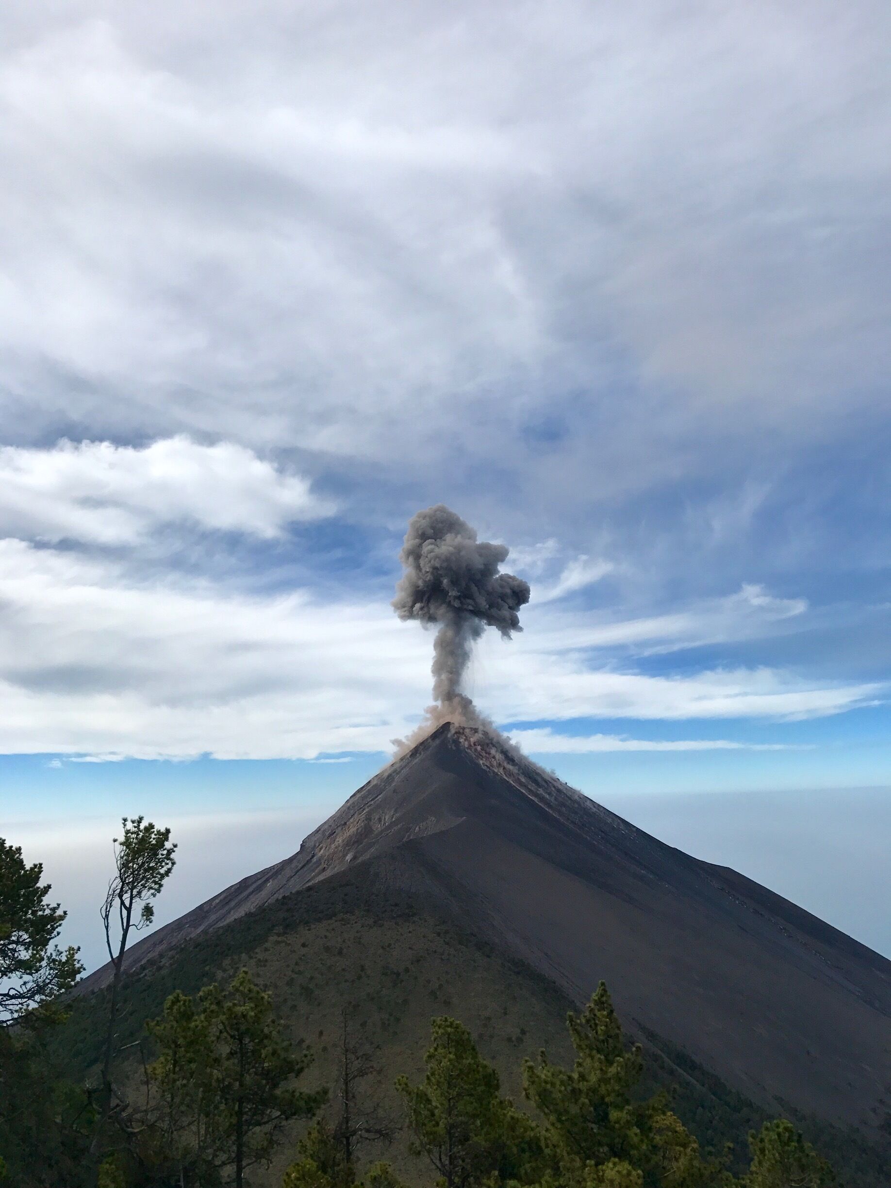 Volcán de Fuego in Guatemala. It is an active volcano that erupts every 20-30 minutes. The lava rushing down the sides at night is absolutely breathtaking. 