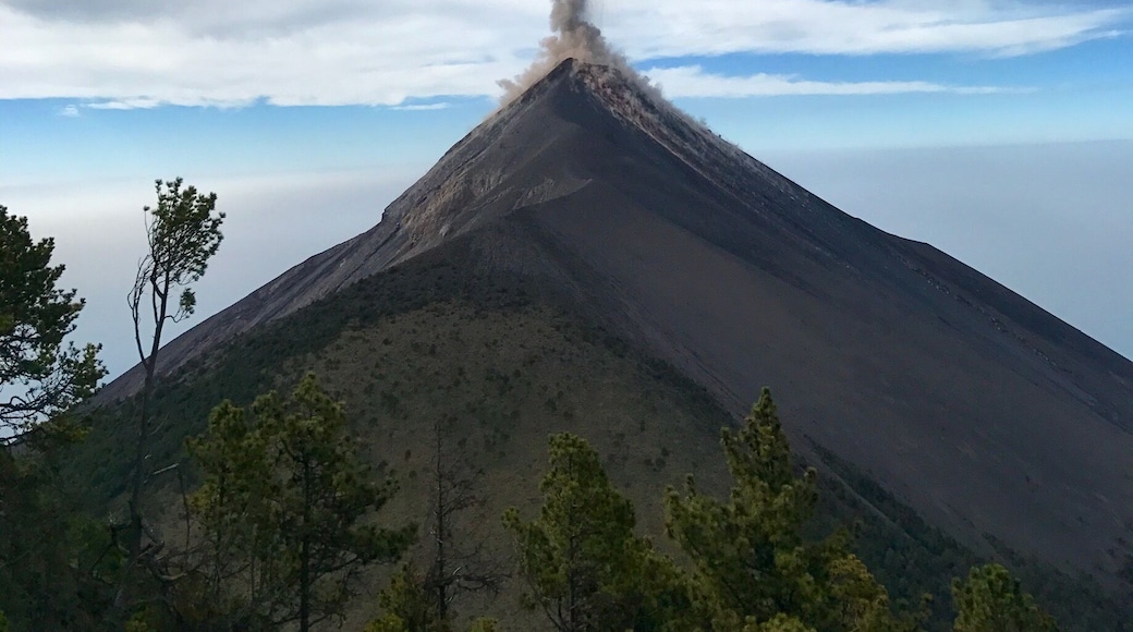 Volcán de Fuego in Guatemala. It is an active volcano that erupts every 20-30 minutes. The lava rushing down the sides at night is absolutely breathtaking.