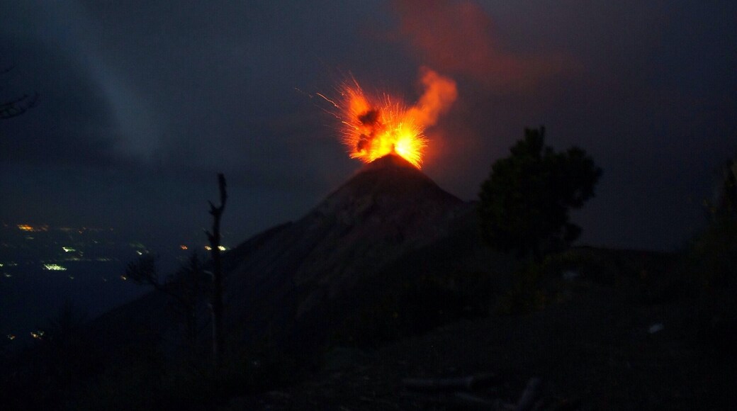 We were the only people on Volcán Acatenango camping the night. The moon was shining right above us, while flashes of lightning were striking below at cloud level. The fog cleared up and we could feel the ground rumbling. All of a sudden, a red plume appears and Volcán Fuego is spewing lava like there's no tomorrow.