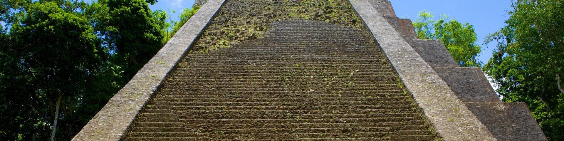 Tikal showing building ruins and heritage elements