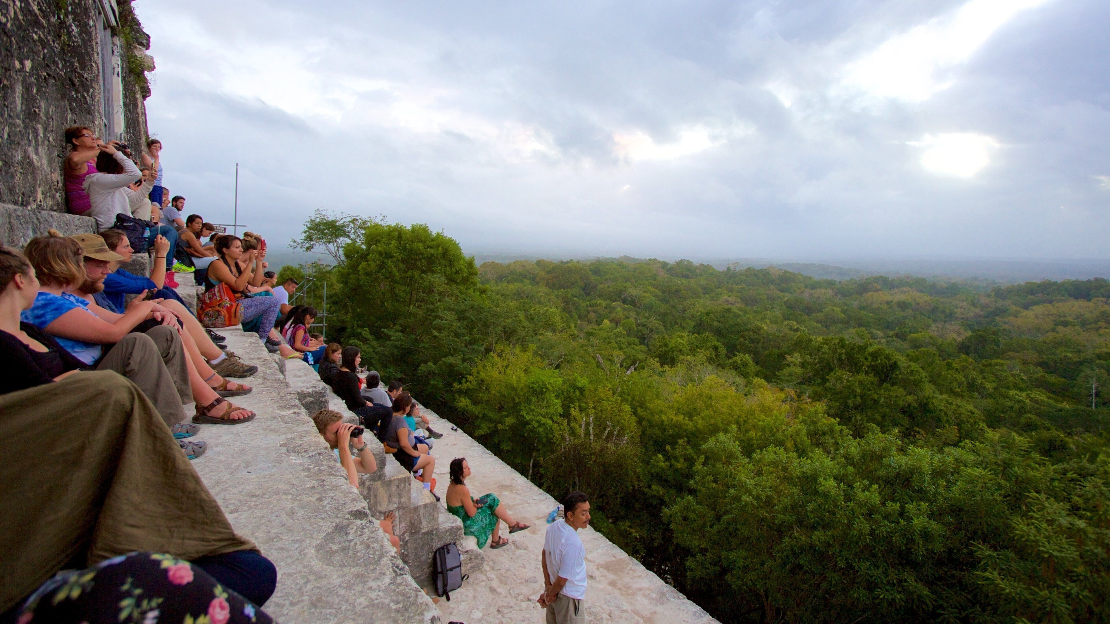 Tikal which includes forests and tranquil scenes as well as a large group of people