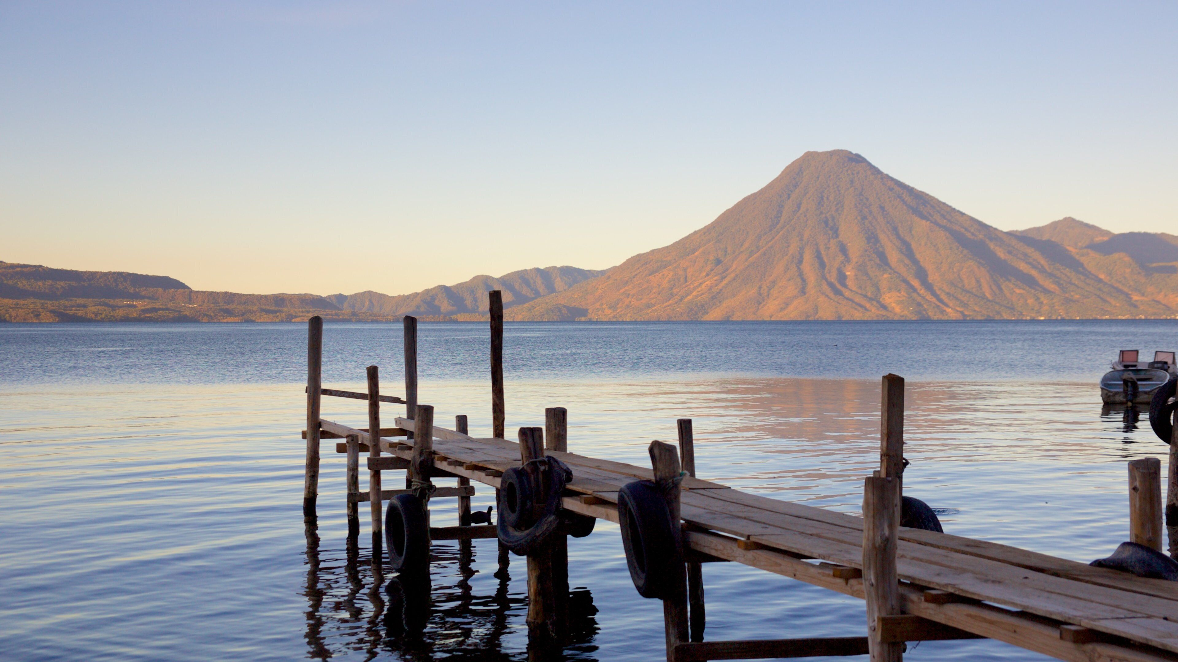 San Pedro Volcano which includes mountains, general coastal views and a bay or harbour