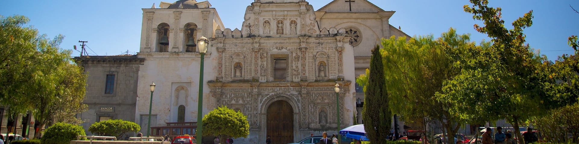 A historic church with intricate architecture and a clear blue sky.